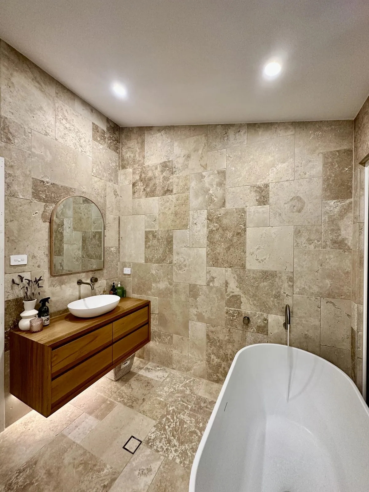 Travertine bathroom lighting